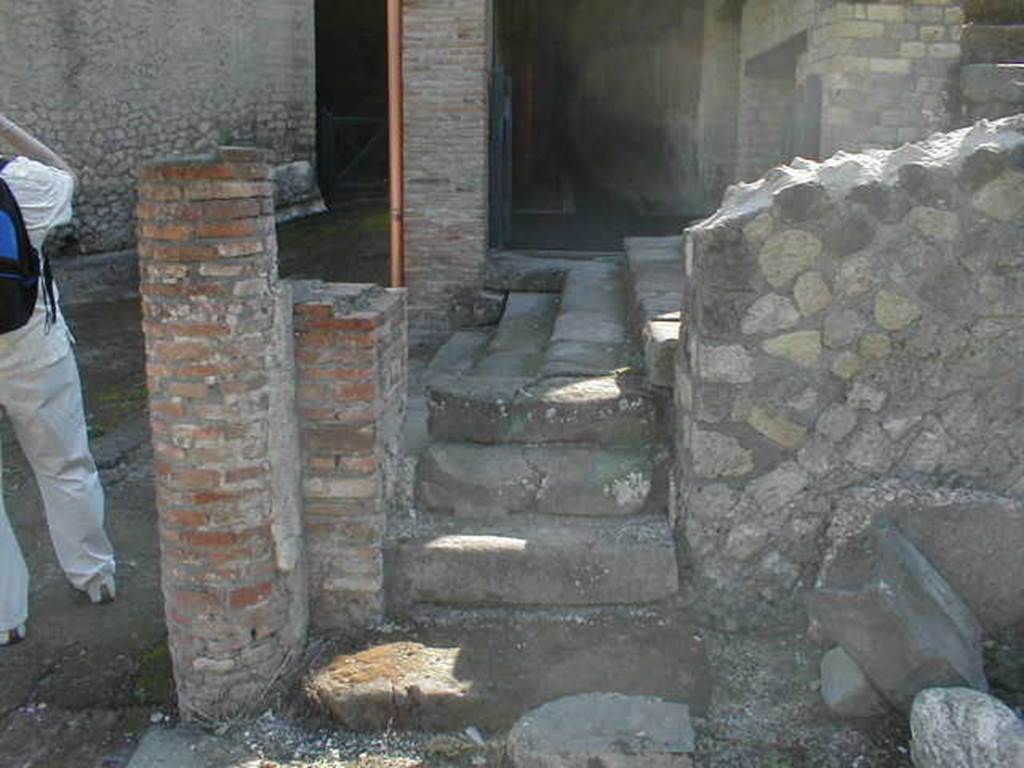 VII.16.a Pompeii. September 2005. Looking east past steps to Via Marina towards entrance corridor B. 
