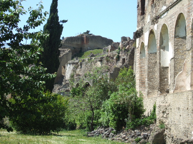 VIII.2.3 Pompeii. December 2005. On the left, site of two rooms on the south-east side, and room on lower level with remains of painted decoration.
