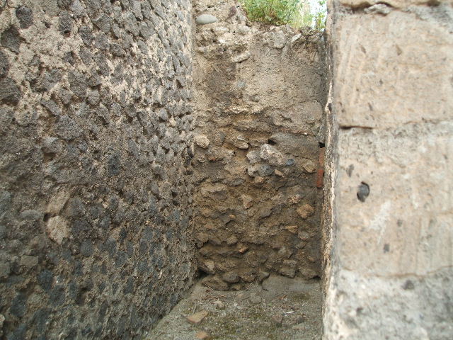 VIII.2.12 Pompeii. May 2005. West wall with doorway to rear.