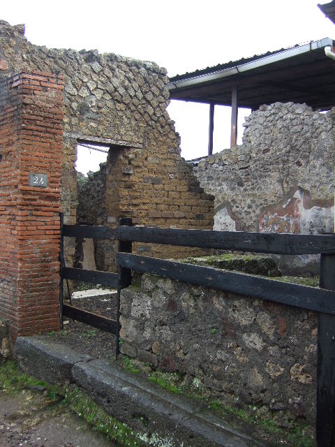 VIII.2.24 Pompeii. December 2005. Looking west to remains of small display shelves on top of bar counter.
