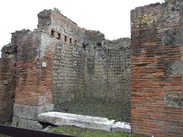VIII.2.31 Pompeii. December 2006. Steps outside on pavement, looking west.