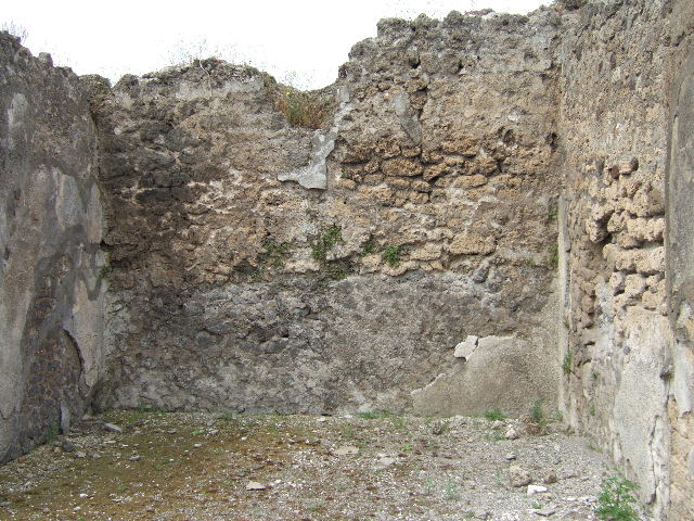 VIII.2.34 Pompeii. May 2006. North-west corner of atrium with doorway to small room and doorway linking to VIII.2.33 on west side.