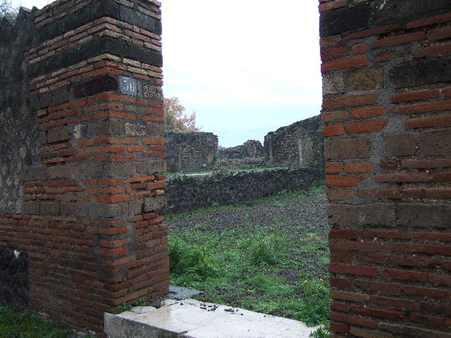 VIII.2.36 Pompeii. May 2006. On the left are the remains of steps to the peristyle of VIII.2.37. On the right is the passage to the lower levels.