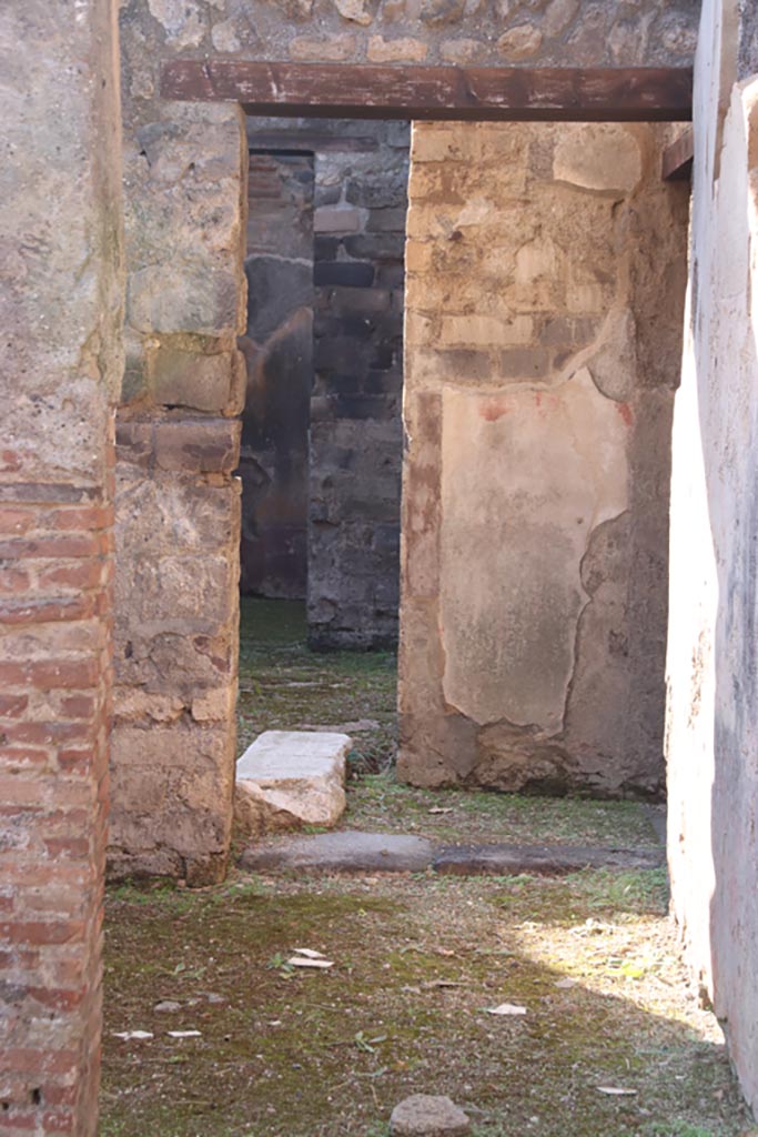 VIII.3.11 Pompeii. October 2022. 
Doorway in south wall, leading into triclinium with window, and through doorway into courtyard near entrance at VIII.3.12.
Photo courtesy of Klaus Heese. 

