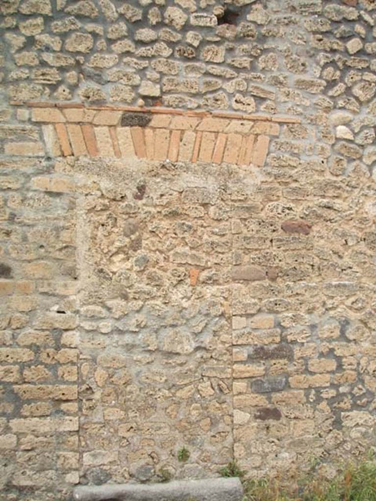 VIII.3.14 Pompeii. May 2005. 
Blocked doorway in exterior wall of Casa della Regina Carolina, looking west.

