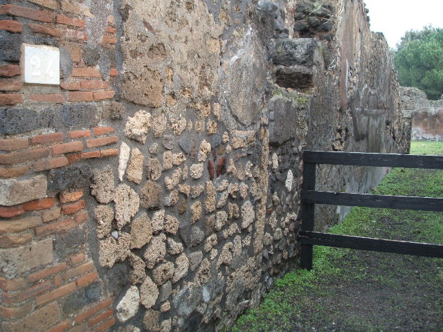 VIII.3.24 Pompeii. December 2007. Looking north-east across peristyle.
In the photo above, the doorway that can be seen right of centre leads to a kitchen and latrine. Found on the plaster facing the hearth, written in faint letters was the graffito –
AELIVS . MAGNVS . PLOTILLAE SVAE
                                      ROGO DOMINA SALVTEM        [CIL IV 1991]
See Pappalardo, U., 2001. La Descrizione di Pompei per Giuseppe Fiorelli (1875). Napoli: Massa Editore. (p.125)
According to Epigraphik-Datenbank Clauss/Slaby (See www.manfredclauss.de) this read as -
Aelius  Magnus  Plotillae  suae
rogo  domina  salutem       [CIL IV 1991]
