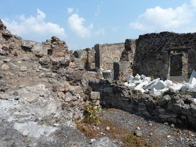 VIII.3.31 Pompeii. May 2010. Large exedra with window, on east side of the peristyle. Taken across the wall of VIII.3.29.
