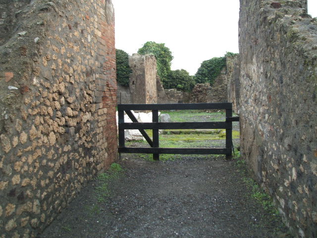 VIII.3.31 Pompeii. December 2004. Two doorways to rooms on the south side of atrium.