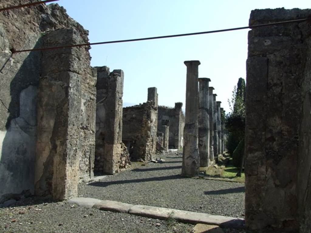 VIII.4.15 Pompeii.  March 2009.  Room 5.  Oecus. Looking south from doorway, onto north and east portico of garden.