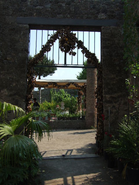 VIII.5.16 Pompeii. December 2006. North Portico, looking south east across garden area.
