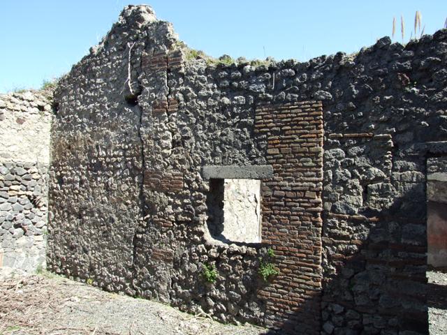 VIII.5.39 Pompeii.  March 2009.  Room 8, West wall, with doorway to Room 7.