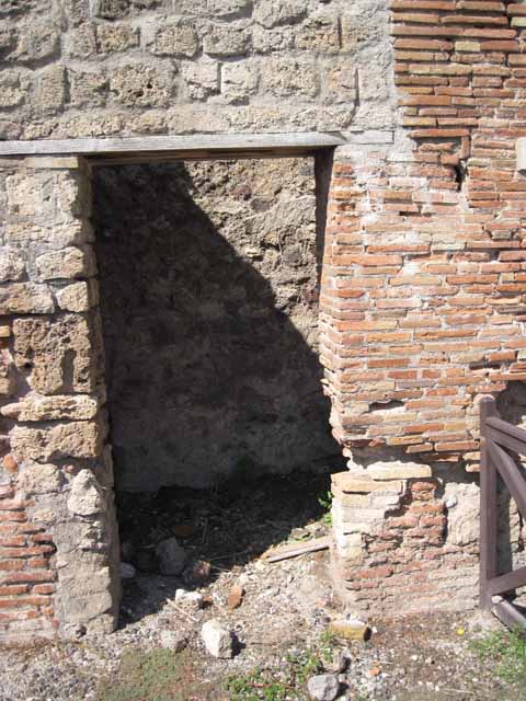 VIII.7.23 Pompeii. May 2005. Doorway to small room or latrine. Looking north-west.