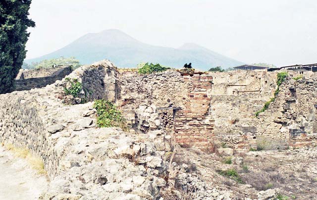 VIII.7.26 Pompeii. September 2010. South wall of garden and south-west corner, looking south towards Odeon. Photo courtesy of Drew Baker.