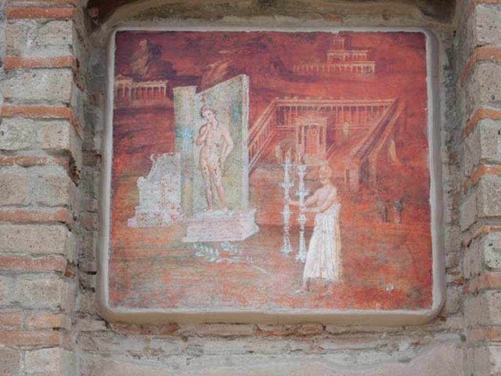 VIII.7.28 Pompeii. May 2017. East portico niche with reproduction of the fresco with a montage of features concerned with the worship of Isis. Now in Naples Archaeological Museum. Inventory number 8975. Photo courtesy of Buzz Ferebee.
