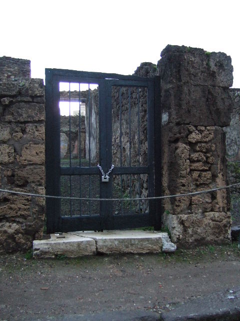 IX.1.7 Pompeii.  December 2007.  Remains of stone stairs on north wall of corridor.