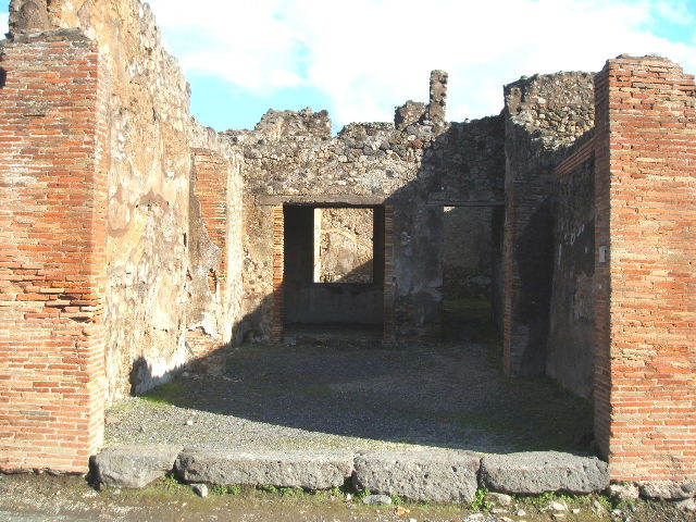 IX.2.5 Pompeii. December 2005. Looking east from shop towards rear.