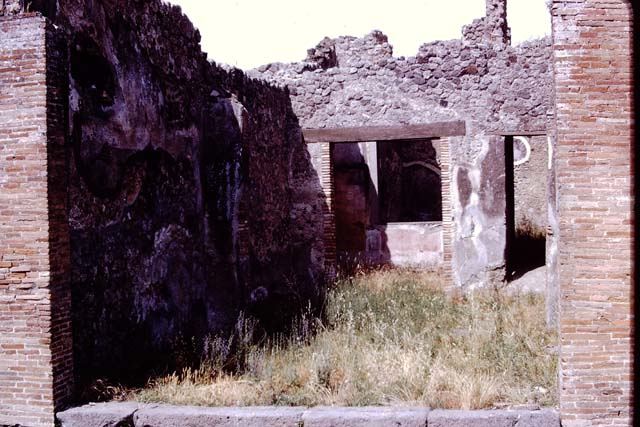 IX.2.5 Pompeii. March 2009. Doorway to triclinium. North-east corner, and window to garden in east wall.