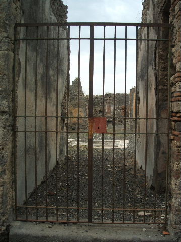 IX.2.18 Pompeii. September 2004. Entrance. Graffito found on the right side of the entrance, between IX.2.18 and IX.2.19, read:

P . PAQVIVM . PROCVLVM . II . VIR . I . D .
                 MARCELLVS . ROG     [CIL IV 3622]

and underneath it, the name:

M  FANIVS  RVFVS

See Pappalardo, U., 2001. La Descrizione di Pompei per Giuseppe Fiorelli (1875). Napoli: Massa Editore. (p.143)

According to Della Corte, there were three electoral recommendations written to the side of the entrance:
Vettium  et  Ovidium  (Curv)ius  iuvenis  facit      [CIL IV 3618]       
Curvius  rog(at)     [CIL IV 3619]
P(ublium)  Paquium  Proculum  II vir(um)  i(ure)  d(icundo)  Marcellus  rog(at)     [CIL IV 3622]            
See Della Corte, M., 1965.  Case ed Abitanti di Pompei. Napoli: Fausto Fiorentino. (p.211)


