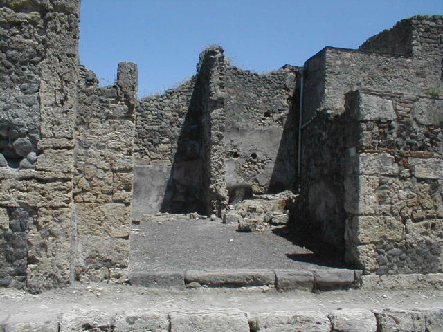 IX.3.3 Pompeii. May 2010. Steps to upper floor in south-east corner of shop. The area at the rear is part of IX.3.4.