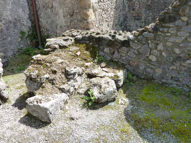 IX.3.3 Pompeii. March 2009. North wall of shop and floor. Looking north-west to entrance..