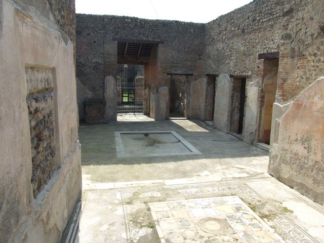 IX.3.5 Pompeii. March 2009.  Room 26.  Aedicula decorated with mosaics and shells and fountain cascading down white marble steps.
