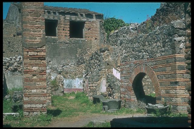IX.3.12 Pompeii. March 2009. Niche on south wall. According to Boyce, the niche had green and brown leaves and red flowers. On the white plaster surrounding the niche, there were paintings. See Boyce G. K., 1937. Corpus of the Lararia of Pompeii. Rome: MAAR 14. (p.83 and Pl.26,1).