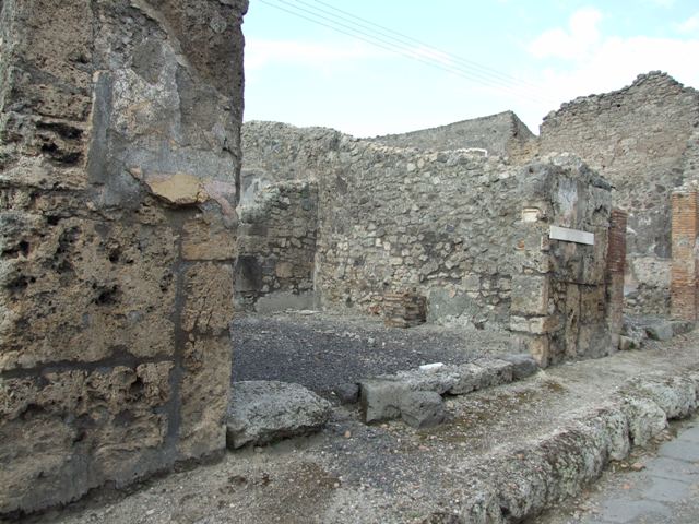 IX.3.17  Pompeii.  March 2009.  West side of workshop.  Remains of bench with water basin.