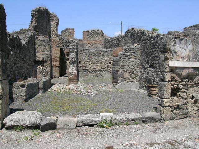 IX.3.17 Pompeii. March 2009. Corridor with steps to upper floor, (on left), and rear room, (on right).
