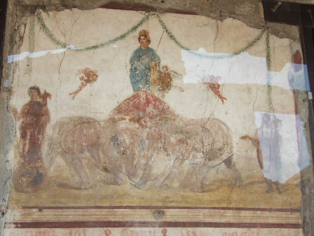 Between  IX.7.7 and IX.7.6 Pompeii. May 2006,  Upper part of painting of Venus riding in a chariot pulled by elephants, from pilaster on east side of doorway.
