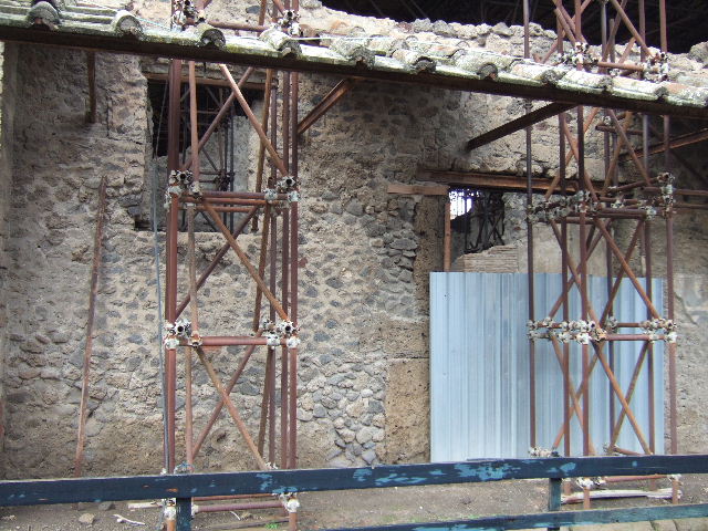 IX.12.6 Pompeii. May 2010.  Looking south to room 10 with street entrance at IX.12.6, and room 11 with window, on the right.
