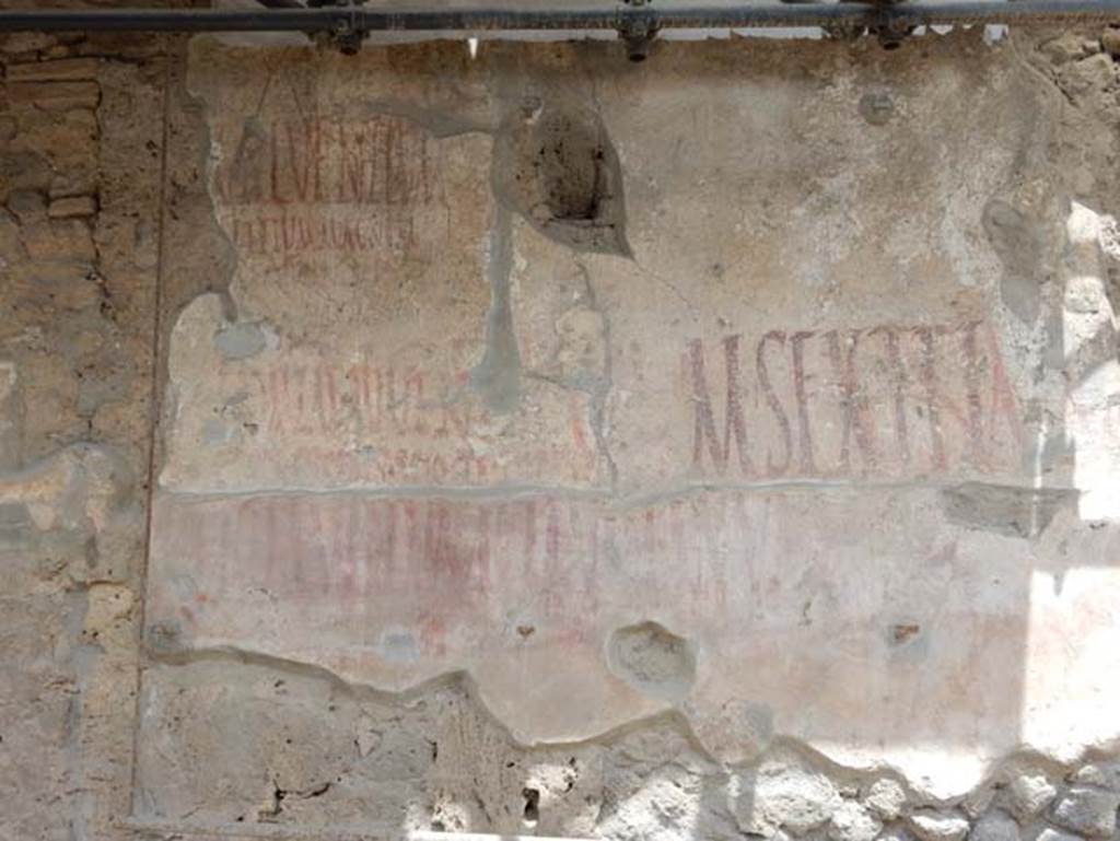 IX.12.7 Pompeii. December 2007. Graffiti between IX.12.6 and IX.12.7
Found here at the side of the window, was CIL IV 7916, underneath was CIL IV 7917. Only part of CIL IV 7917 is visible now. See Varone, A. and Stefani, G., 2009. Titulorum Pictorum Pompeianorum, Rome: L’erma di Bretschneider (p.455)
According to Epigraphik-Datenbank Clauss/Slaby (See www.manfredclauss.de), these read as -
C(aium)  Lollium 
Fuscum  aed(ilem)  d(ignum)  r(ei)  p(ublicae)  o(ro)  v(os)  f(aciatis)       [CIL IV 7916]
M(arcum)  Sextilium  aed(ilem)  o(ro)  v(os)  f(aciatis)  d(ignum)  r(ei)  p(ublicae)       [CIL IV 7917]

