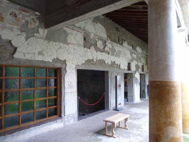 IX.13.1-3 Pompeii. May 2010. Room 13, three reproduction couches and tables.