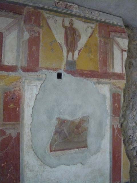 IX.13.1-3 Pompeii. May 2010. Room 9, south wall with painted graffiti between window of room 14, and doorway to room 15.