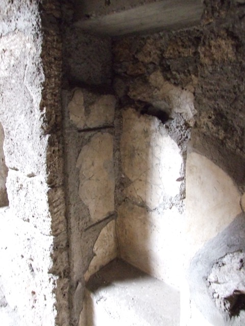 IX.13.1-3 Pompeii. March 2009. Room 2, north-east corner of atrium.
Recess with 1 niche above, and 1 niche in east side.