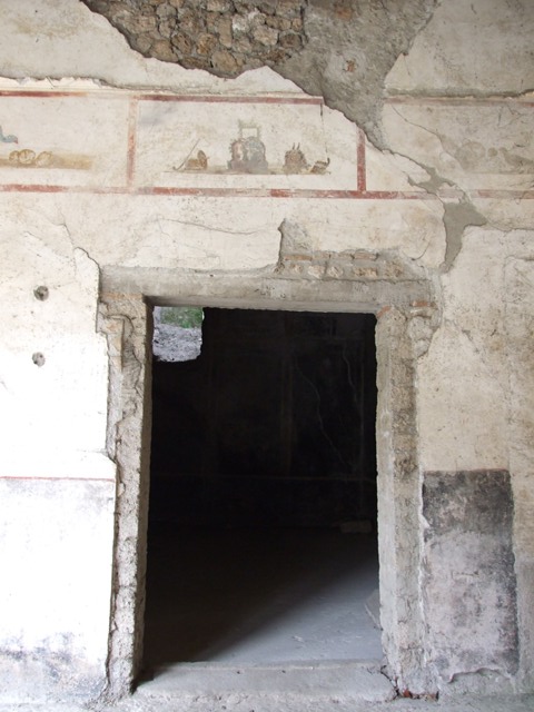 IX.13.1-3 Pompeii. March 2009. Room 9, plaster casts of cupboards or chests against east wall of portico.