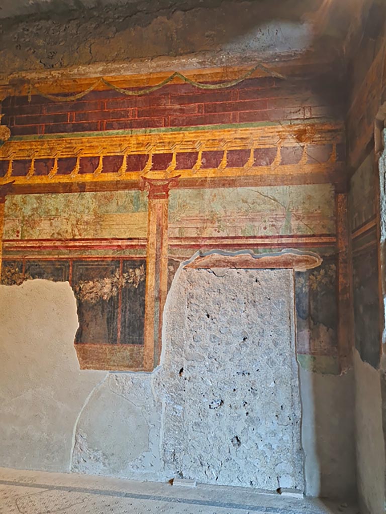 Villa of Mysteries, Pompeii. November 2023. 
Room 6, east wall with blocked doorway at south end. Photo courtesy of Giuseppe Ciaramella.
