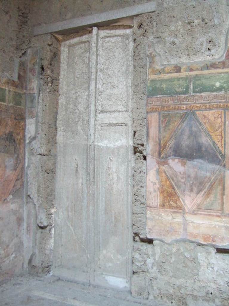 Villa of Mysteries, Pompeii. May 2006. Room 64, cast of door in north-east corner.