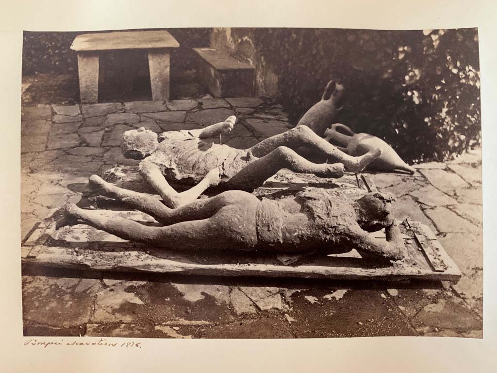 Via del Vesuvio, Pompeii. Album by M. Amodio, c.1880, entitled “Pompei, destroyed on 23 November 79, discovered in 1748”.
These fugitives were found in the middle of the Via del Vesuvio (Via Stabiana) at about a height of four metres from the ancient street level, near the north-eastern corner of Reg. VI.14. Photo courtesy of Rick Bauer.
