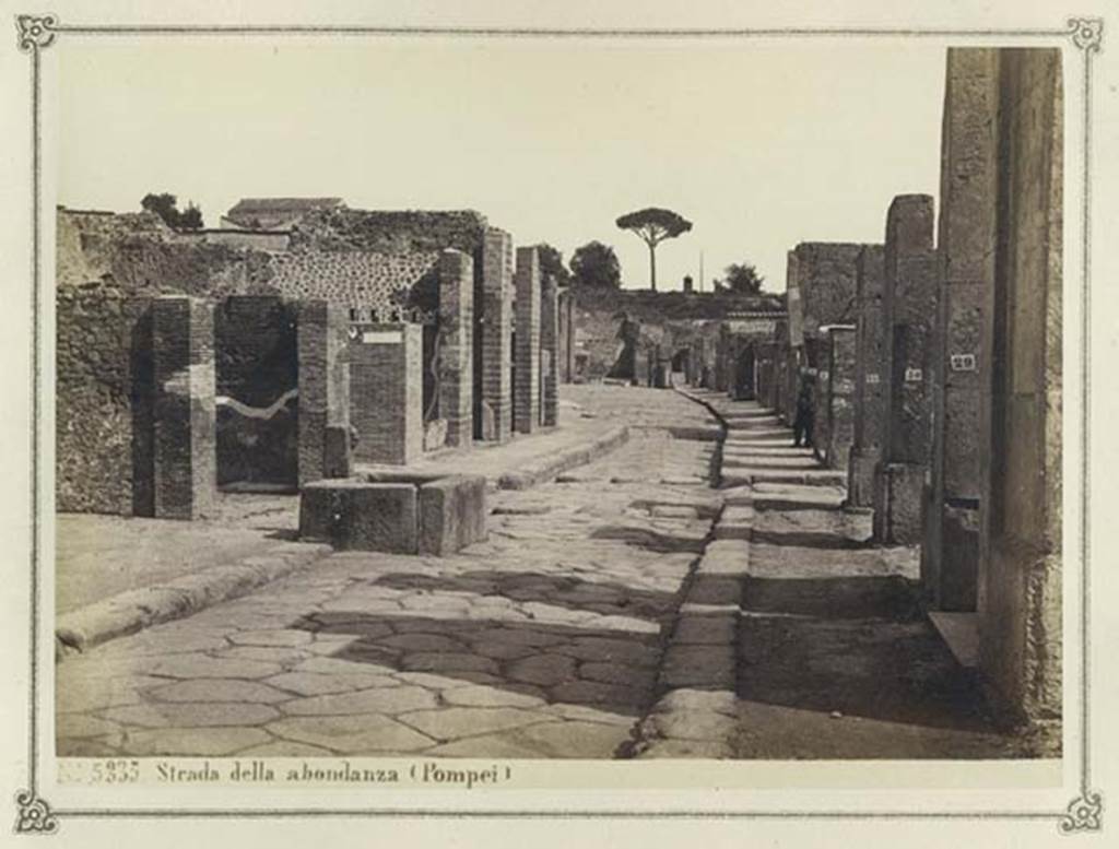 Via dell’Abbondanza. From an album dated February 1874. Looking east from near fountain at VII.14.13/14.
In the distance is the “as-yet-unexcavated” area near Holconius crossroads. Photo courtesy of Rick Bauer.
