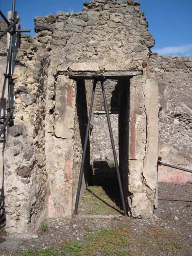 I.2.10 Pompeii. September 2010. East wall of atrium, with doorway into corridor leading to rear. Photo courtesy of Drew Baker.