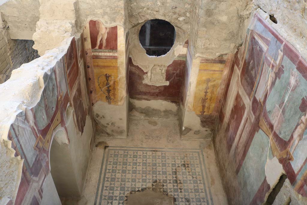 I.6.2 Pompeii. December 2018. Frigidarium of baths’ area.
Looking down on west wall and circular window through into corridor in east wing of cryptoporticus. Photo courtesy of Aude Durand.