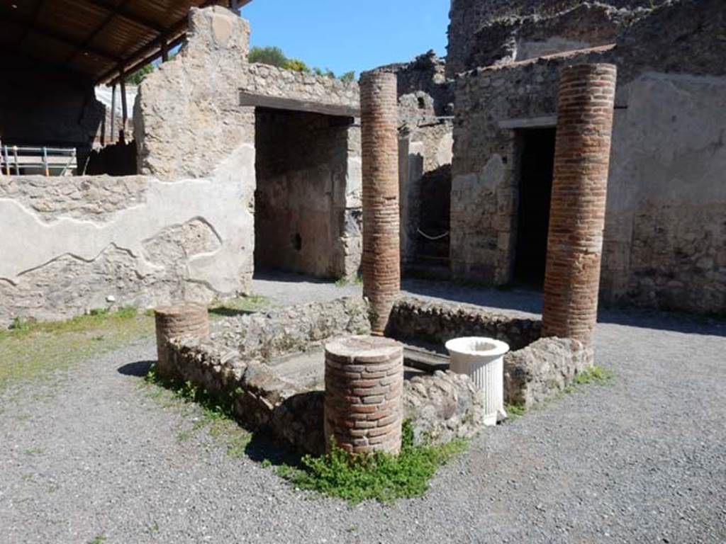 I.6.2 Pompeii. May 2016. Looking north-east across impluvium in atrium, towards stairs to upper floor. Photo courtesy of Buzz Ferebee.