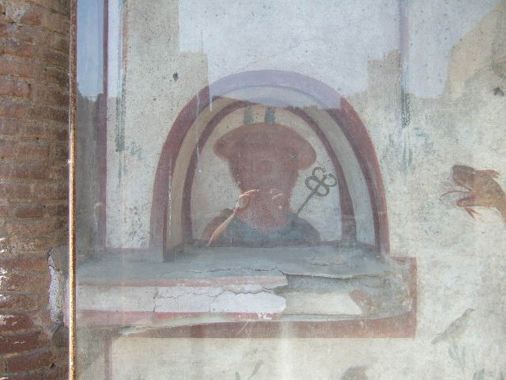I.6.2 Pompeii. May 2006. Niche with painting of Mercury, on the lararium.