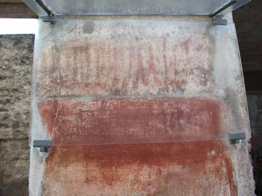 I.6.7 Pompeii. May 2010. Painted graffiti on east side of entrance.