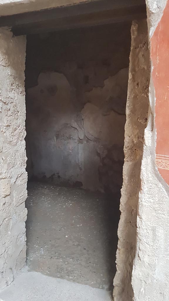 I.6.7 Pompeii. August 2023.
Looking east through doorway to room on east wall of atrium. Photo courtesy of Maribel Velasco.