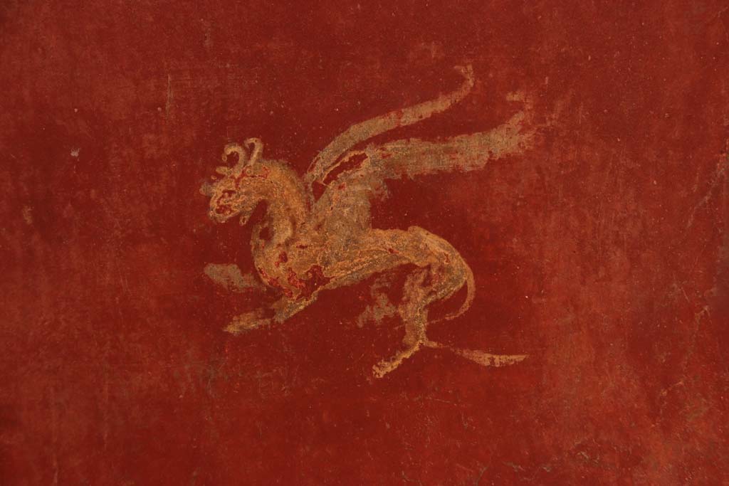 I.6.7 Pompeii. September 2019. Detail of painted decoration from centre of panel on north side of doorway in south-east corner of atrium.
Photo courtesy of Klaus Heese.