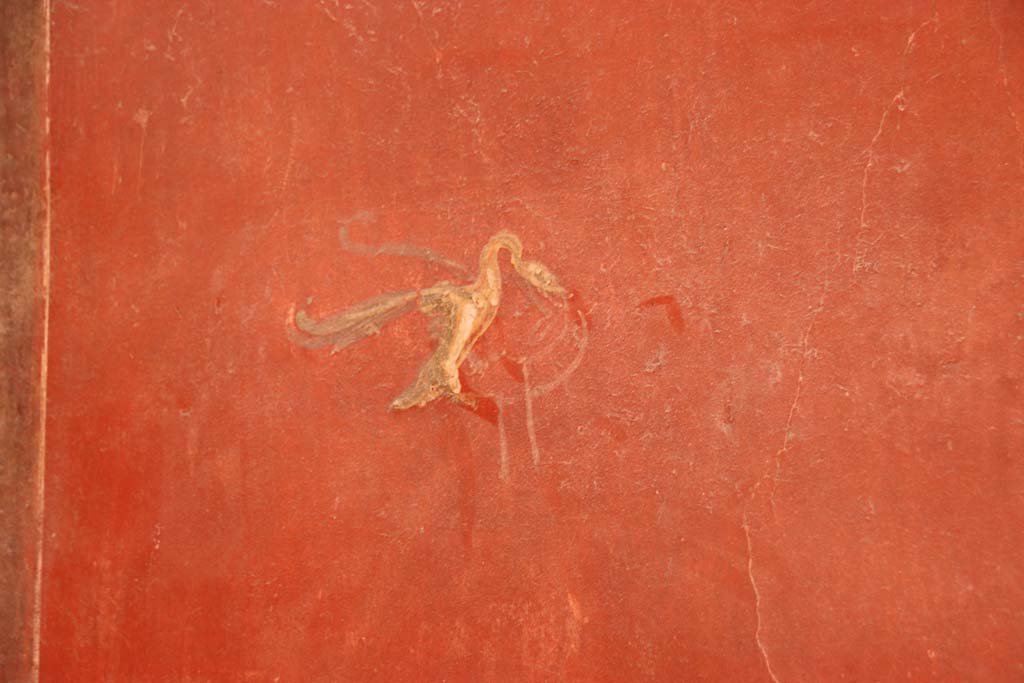 I.6.7 Pompeii. September 2019.
Detail of painted decoration in centre of panel on south wall on west side of doorway in south-east corner of atrium.
Photo courtesy of Klaus Heese.