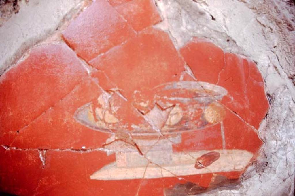 I.7.1 Pompeii, 1968. Detail of painted vignette of glass vase/dish and fruit, on east wall of atrium.
Photo by Stanley A. Jashemski.
Source: The Wilhelmina and Stanley A. Jashemski archive in the University of Maryland Library, Special Collections (See collection page) and made available under the Creative Commons Attribution-Non Commercial License v.4. See Licence and use details.
J68f0452