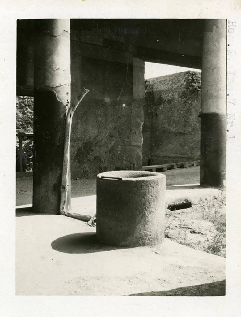 I.7.1 Pompeii. Pre-1937-39. Lava puteal in north-east corner of peristyle.
Photo courtesy of American Academy in Rome, Photographic Archive. Warsher collection no. 1889.