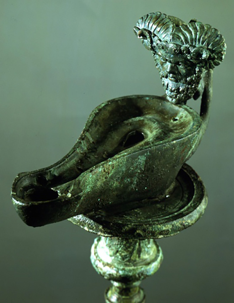 I.7.1 Pompeii. Bronze lamp with head of the oracle god Jupiter Ammon.
SAP 3244a. Soldered to top of candelabrum SAP 3244.